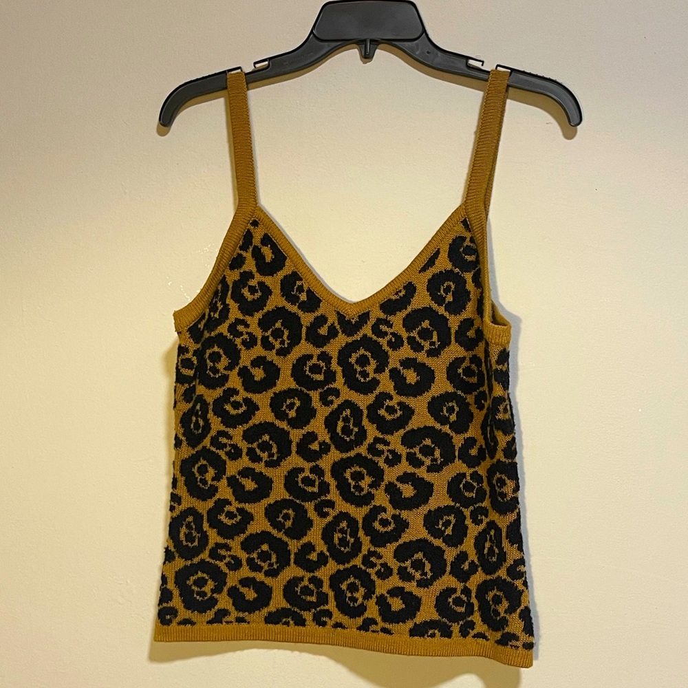 Cute cheetah printed string blouse and it has a soft almost blanket texture.